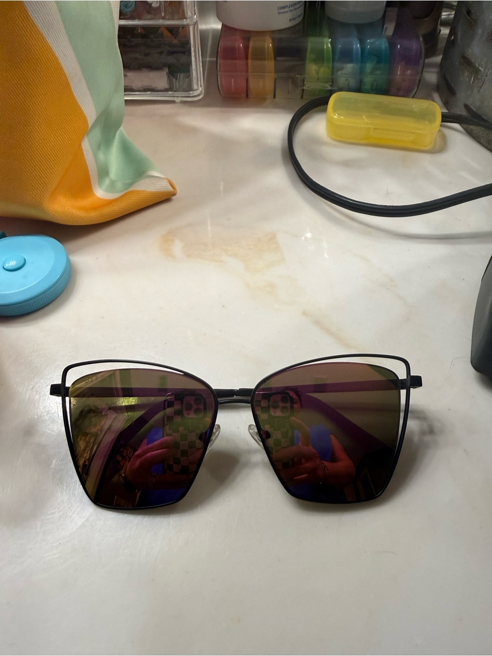Women’s Diff Becky III sunglasses with matte black frames, pink mirrored lenses.